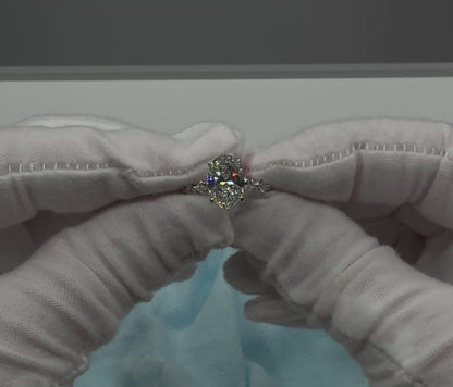 Four-Prong Oval Cut Engagement Ring with Marquise and Round Diamond Band