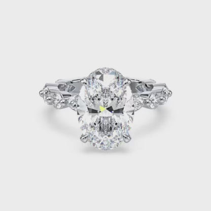 Four-Prong Oval Cut Engagement Ring with Marquise and Round Diamond Band